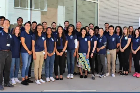 The BrainSPORT team standing in a group outside of a building.