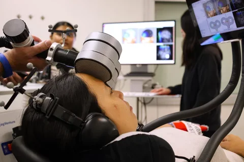 A patient takes part in a clinical trial on whether brain stimulation can help treat post-concussion symptoms.