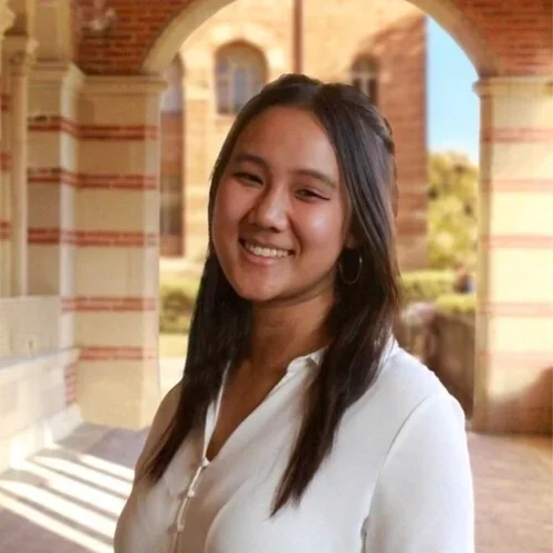 Adelyne Tran standing in the hallways of Royce Hall at UCLA.