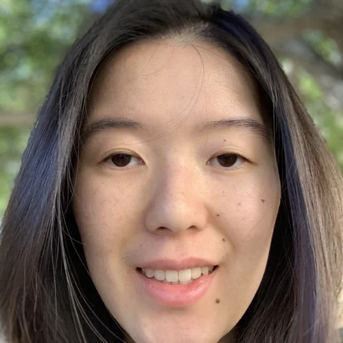 Alice smiling outdoors