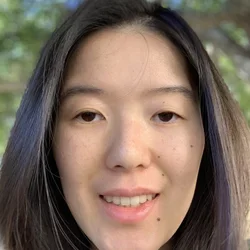 Alice smiling outdoors